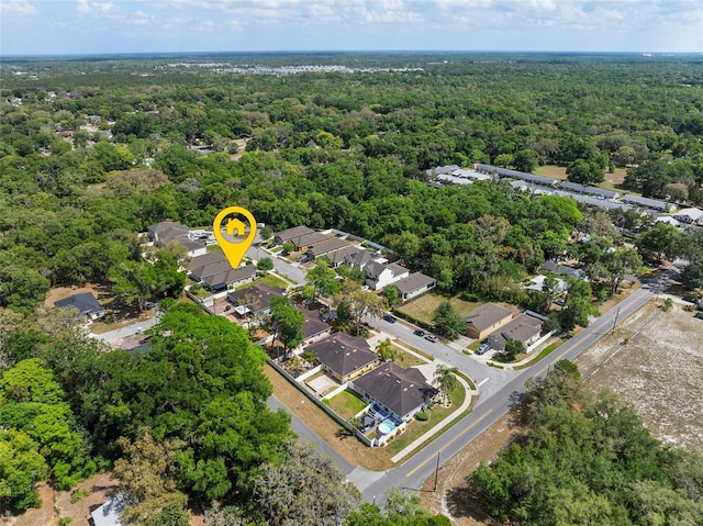 aerial view with a forest view and a residential view