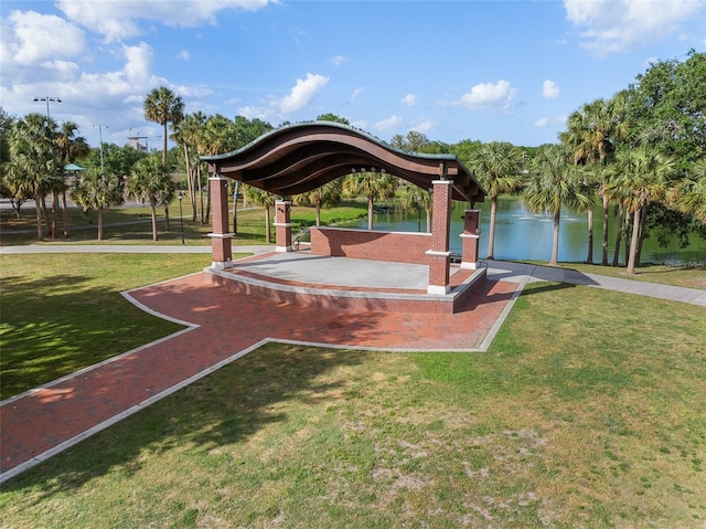 view of home's community featuring a yard and a water view