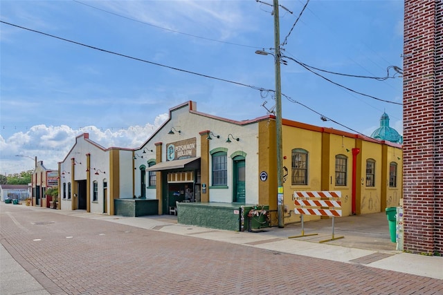 view of front of house with brick siding and stucco siding
