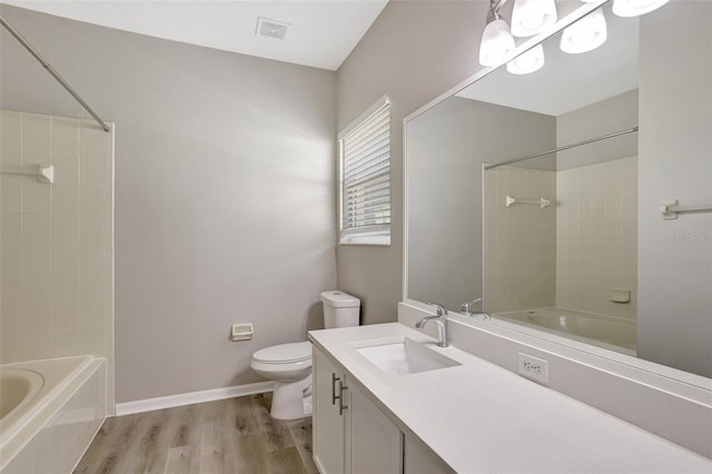 full bath featuring toilet, wood finished floors, bathtub / shower combination, and visible vents