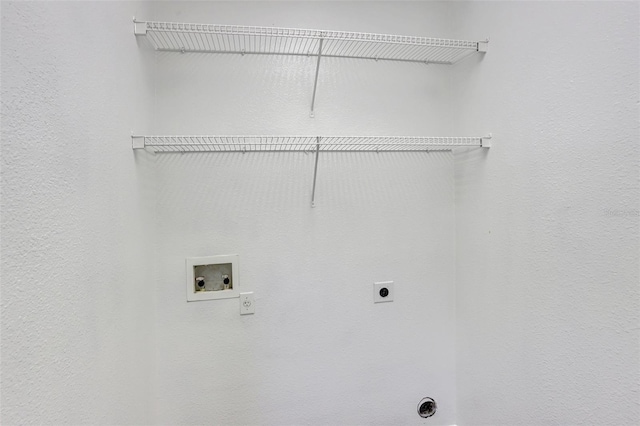 clothes washing area featuring hookup for an electric dryer, laundry area, and washer hookup