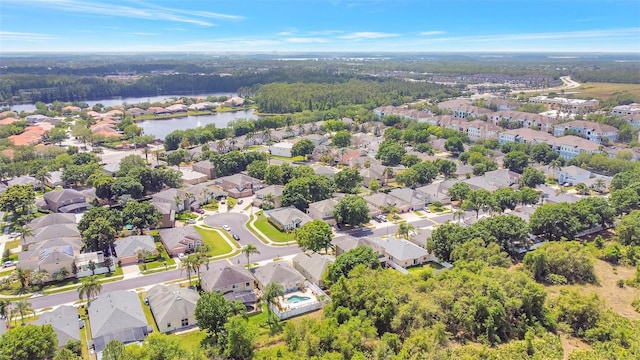 drone / aerial view with a residential view and a water view