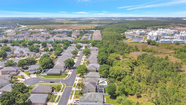 birds eye view of property featuring a residential view and a water view
