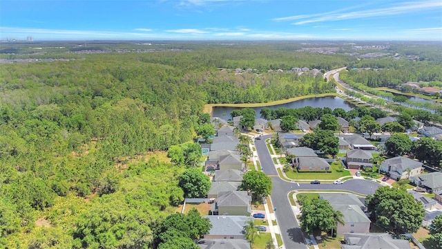 bird's eye view featuring a residential view, a water view, and a view of trees