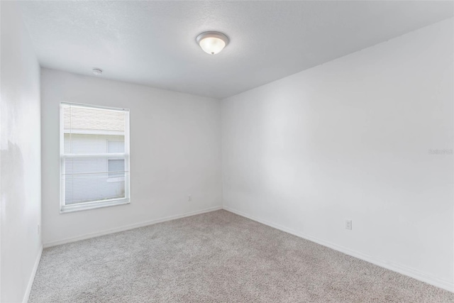 205 Lori Ct, Umatilla, FL 32784 - spare room featuring carpet and baseboards
