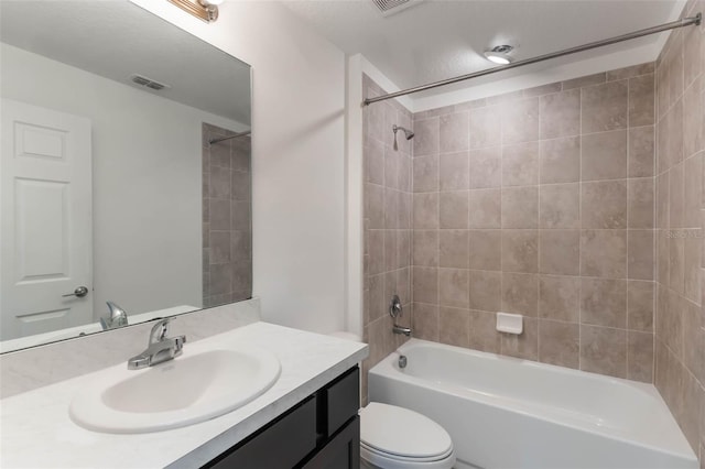 205 Lori Ct, Umatilla, FL 32784 - bathroom featuring toilet, vanity, shower / tub combination, and visible vents