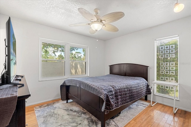 121 Teriwood St, Fern Park, FL 32730 - bedroom with baseboards, a textured ceiling, a ceiling fan, and hardwood / wood-style flooring