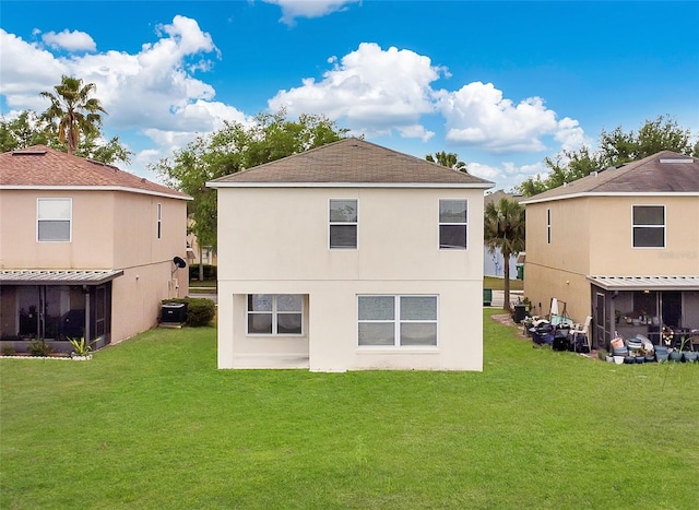 1556 Sherbourne St, Winter Garden, FL 34787 - rear view of house featuring a shingled roof, stucco siding, central AC, and a yard