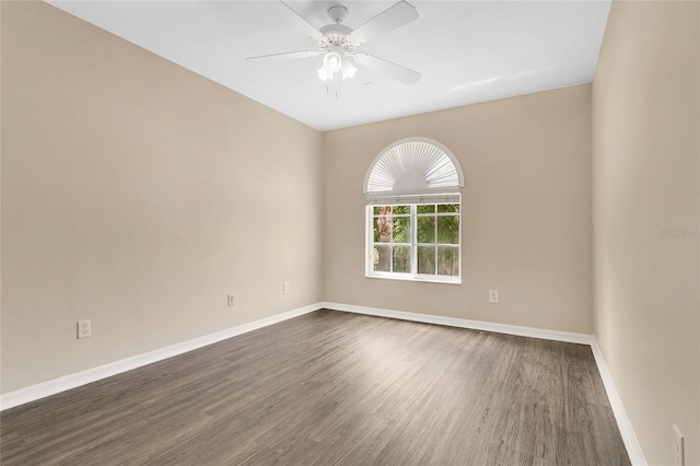 1556 Sherbourne St, Winter Garden, FL 34787 - empty room with dark wood-style floors, ceiling fan, and baseboards
