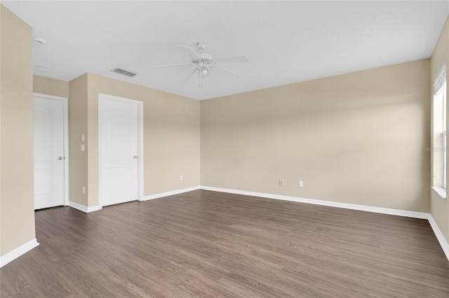 1556 Sherbourne St, Winter Garden, FL 34787 - spare room with baseboards, dark wood-style flooring, ceiling fan, and visible vents