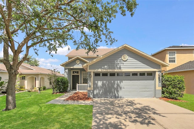 view of front of property with concrete driveway, a front yard, and a garage
