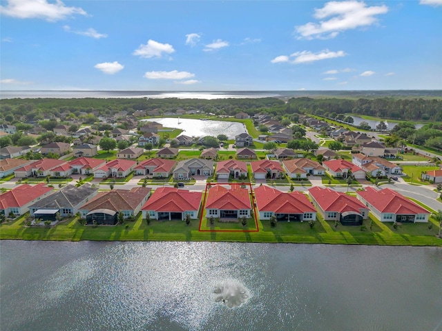 aerial view featuring a residential view and a water view