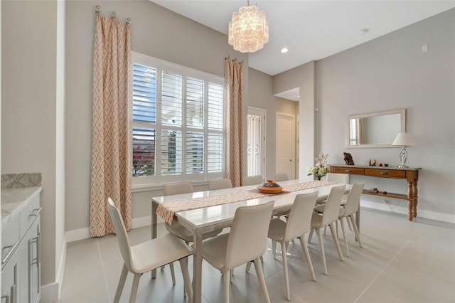 dining room featuring an inviting chandelier, light tile patterned flooring, baseboards, and recessed lighting