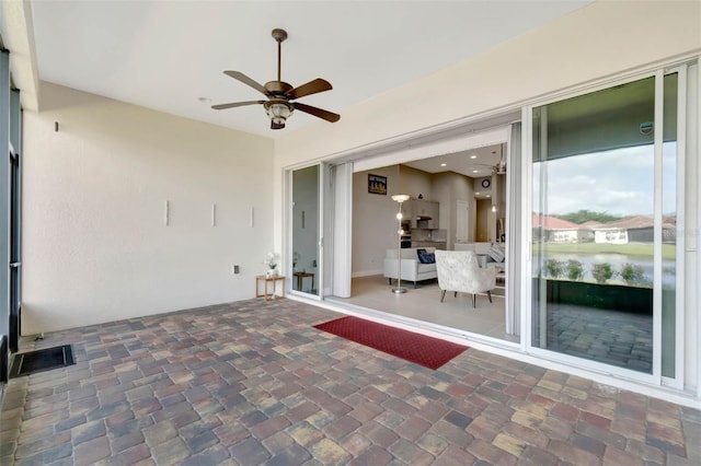 view of patio / terrace with ceiling fan and visible vents