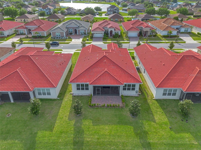 birds eye view of property with a residential view