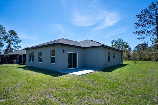 5 Fisher Loop, Ocklawaha, FL 32179 - back of house with a yard, a patio, and stucco siding