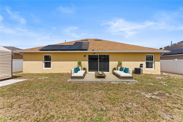 408 Magpie Ct, Kissimmee, FL 34759 - rear view of house featuring stucco siding, solar panels, and a shingled roof