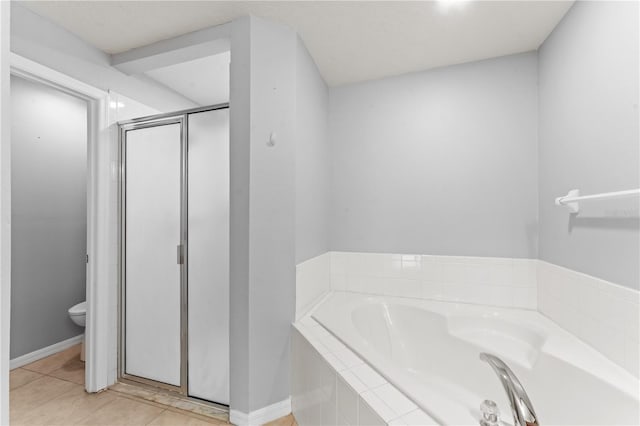 408 Magpie Ct, Kissimmee, FL 34759 - full bath with a garden tub, a shower stall, and tile patterned flooring