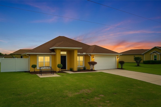 408 Magpie Ct, Kissimmee, FL 34759 - single story home with concrete driveway, stucco siding, and an attached garage
