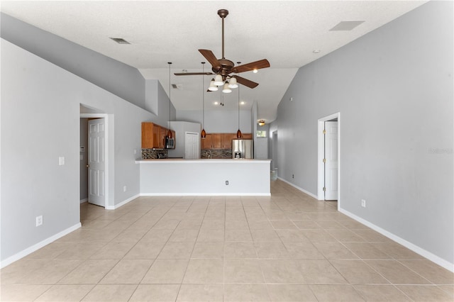 408 Magpie Ct, Kissimmee, FL 34759 - unfurnished living room featuring a ceiling fan, light tile patterned flooring, and high vaulted ceiling