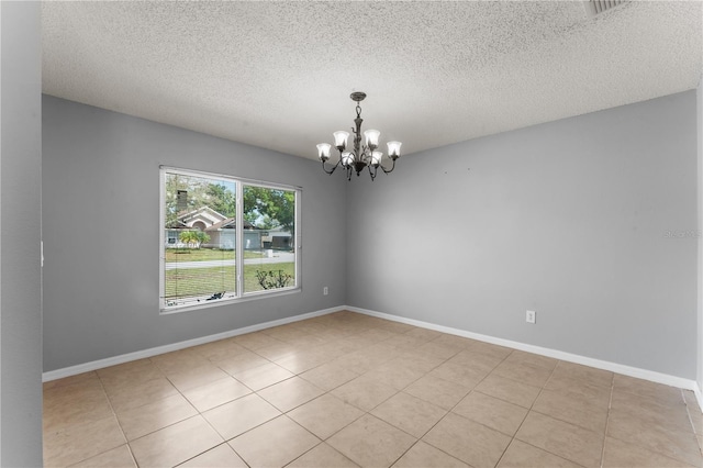 408 Magpie Ct, Kissimmee, FL 34759 - unfurnished room with a chandelier, a textured ceiling, and light tile patterned flooring