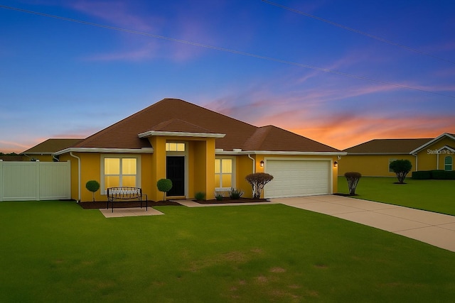 408 Magpie Ct, Kissimmee, FL 34759 - ranch-style home with driveway, an attached garage, and stucco siding