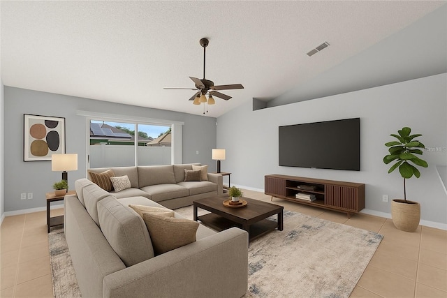 408 Magpie Ct, Kissimmee, FL 34759 - living area with light tile patterned flooring, a ceiling fan, lofted ceiling, and a textured ceiling