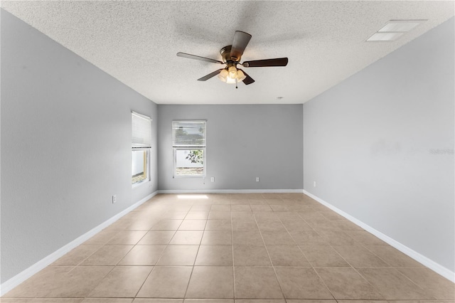 408 Magpie Ct, Kissimmee, FL 34759 - unfurnished room with a ceiling fan, a textured ceiling, and light tile patterned flooring