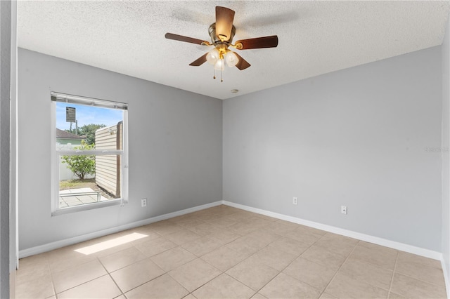 408 Magpie Ct, Kissimmee, FL 34759 - empty room with a textured ceiling, a ceiling fan, and light tile patterned floors