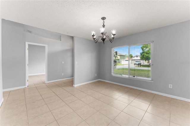 408 Magpie Ct, Kissimmee, FL 34759 - unfurnished room with a textured ceiling, a chandelier, and light tile patterned floors