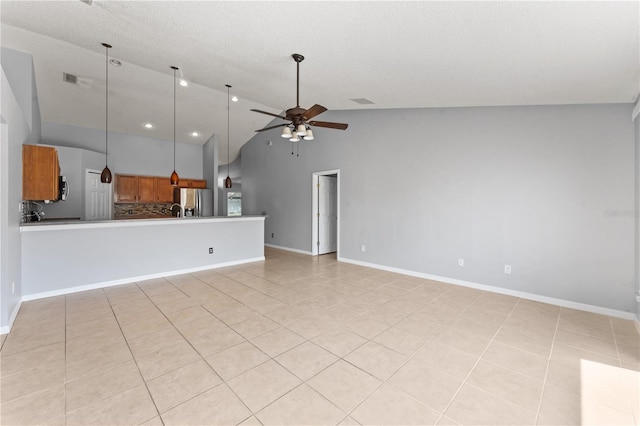408 Magpie Ct, Kissimmee, FL 34759 - unfurnished living room featuring light tile patterned floors, ceiling fan, and high vaulted ceiling