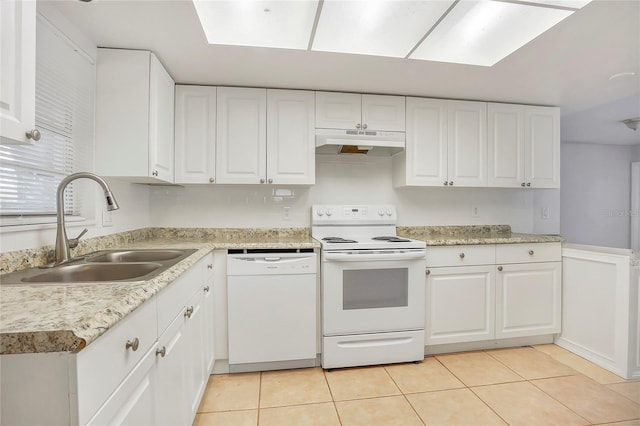 621 Ashberry Ln, Altamonte Springs, FL 32714 - kitchen featuring a sink, under cabinet range hood, light tile patterned floors, white appliances, and white cabinets