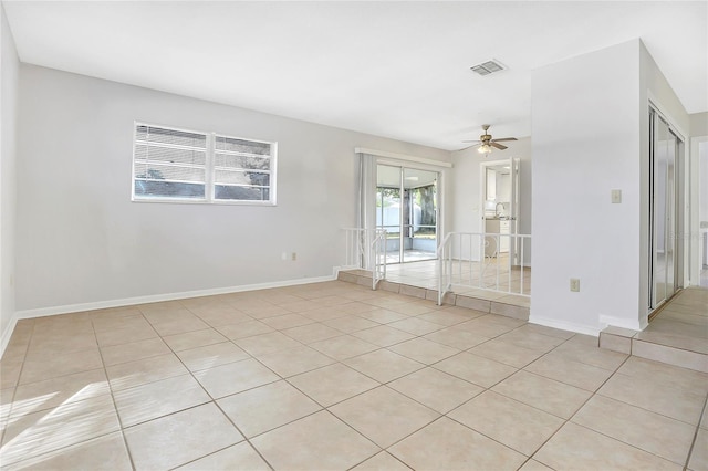 621 Ashberry Ln, Altamonte Springs, FL 32714 - empty room featuring baseboards, visible vents, light tile patterned floors, and a ceiling fan