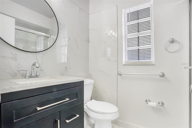 621 Ashberry Ln, Altamonte Springs, FL 32714 - bathroom featuring tile walls, toilet, and vanity