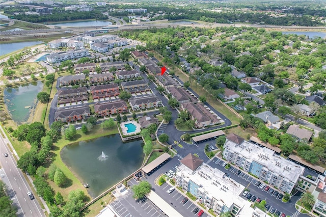 birds eye view of property with a water view