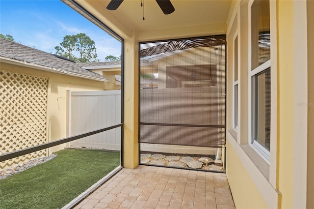 exterior space featuring fence and a ceiling fan