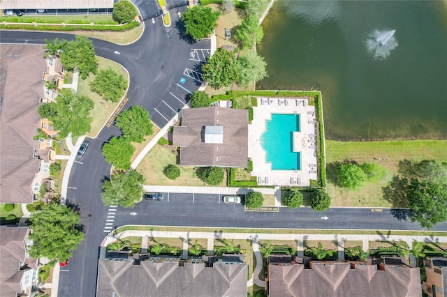 birds eye view of property with a water view