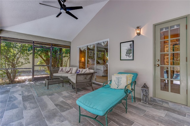 sunroom featuring an outdoor living space and ceiling fan