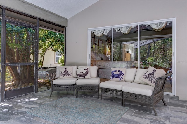 sunroom with an outdoor living space and plenty of natural light