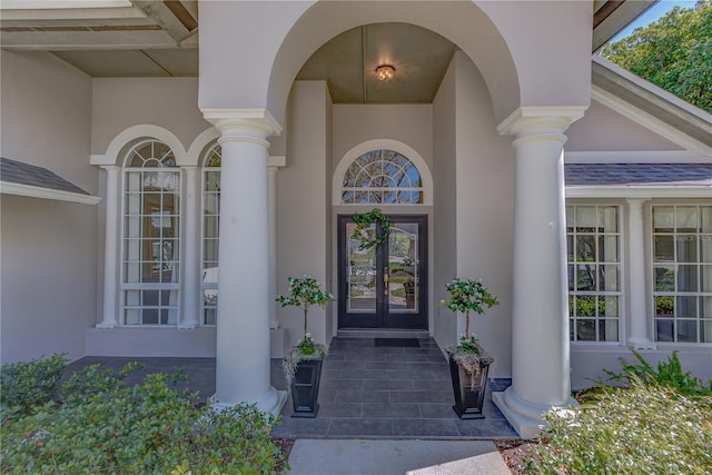 entrance to property with stucco siding