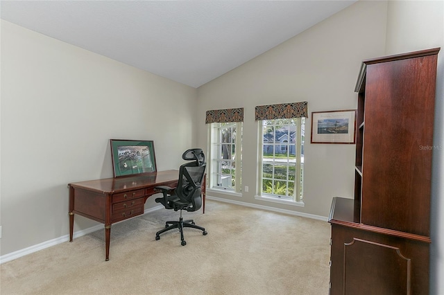 carpeted office featuring baseboards and high vaulted ceiling