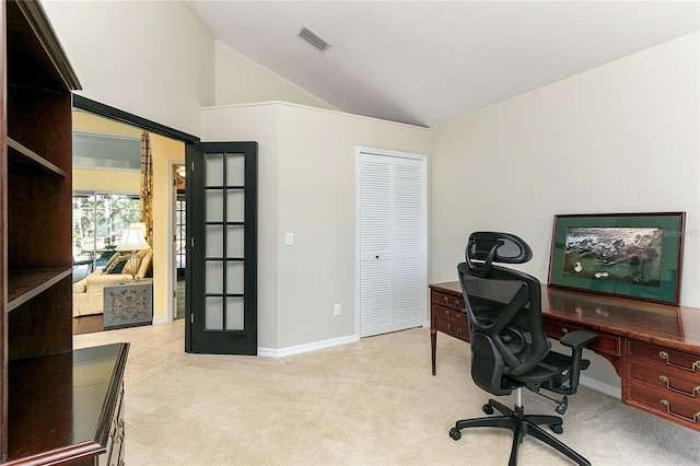 carpeted office featuring visible vents, baseboards, vaulted ceiling, and french doors