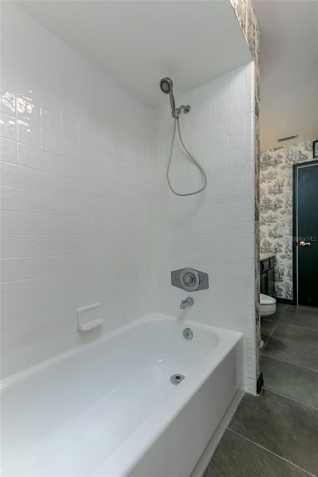 full bathroom with toilet and  shower combination