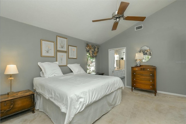 bedroom featuring ensuite bathroom, visible vents, light carpet, lofted ceiling, and baseboards
