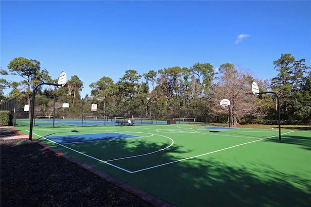 view of sport court featuring community basketball court and fence