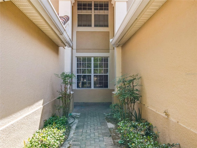 doorway to property with stucco siding