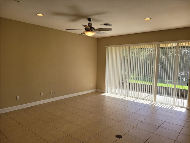 empty room with ceiling fan, tile patterned floors, baseboards, and recessed lighting