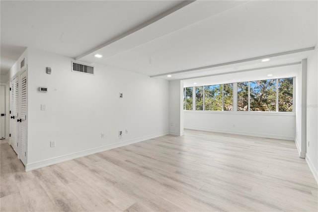 empty room featuring baseboards, recessed lighting, visible vents, and light wood-style floors