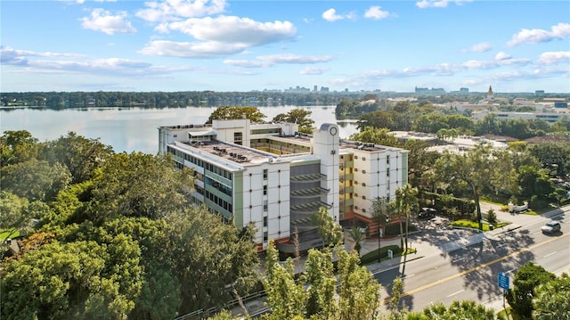 birds eye view of property with a city view and a water view