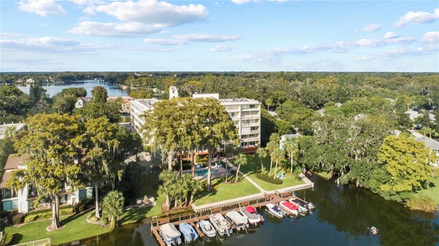 aerial view with a forest view and a water view